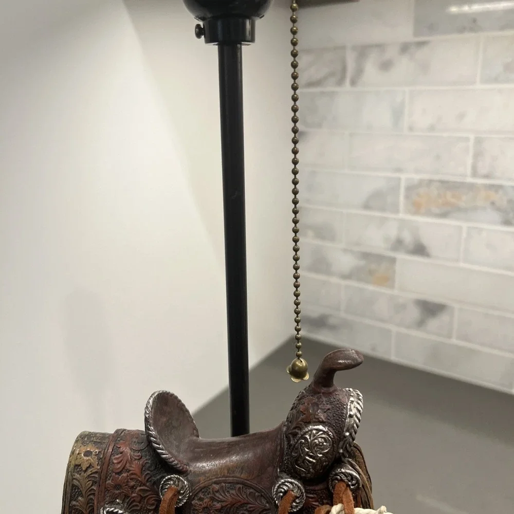 Western vintage Saddle Lamp rope on the saddle, sitting on a wheel/NO LAMP SHADE